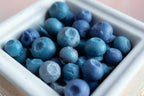 Blueberry-shaped wax melts in a white ceramic dish, dessert-inspired home fragrance
